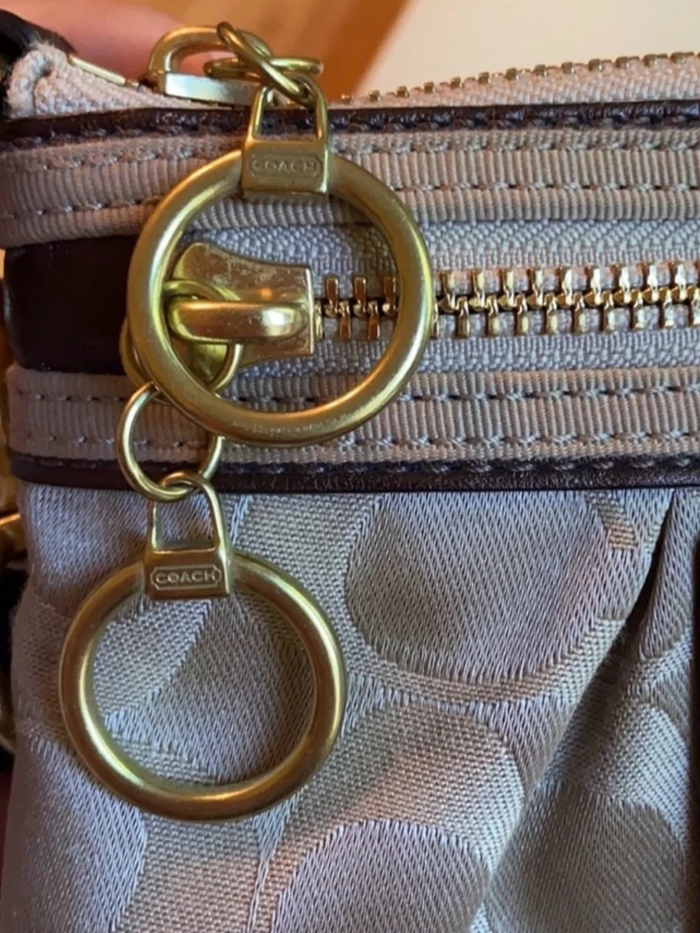 Coach Beige Signature Wristlet Pouch with Gold Logo Plaque